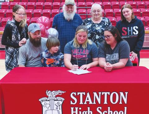 Trinity Johnson is surrounded by her family as she signs her letter of intent to play softball at Dallas Christian College. Left to Right are: her sister Kallie O’Neal, father Landon O’Neal, brother Charles O’Neal, grandfather Casey Nassett, grandmother Virginia Nassett, mother Misty O’Neal, and sister Katlynn O’Neal.
