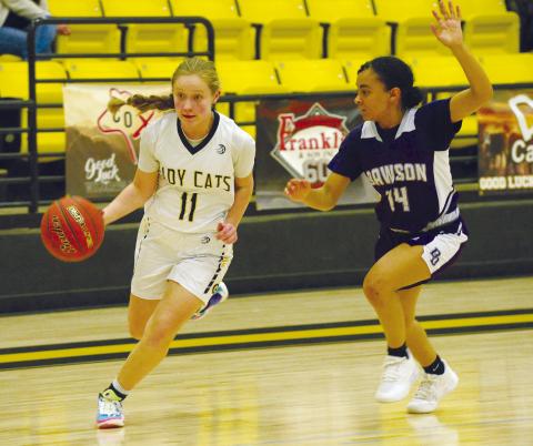 Grady guard Reagan Dennis flies past a Dawson Dragons defender during district action earlier this season. The Wildcats plays Whitharral for bi-district next week.