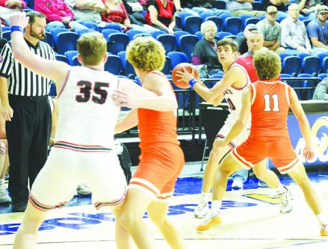 Garden City’s Levi Easterling (10) looks to pass the ball to teammate Jarett Fryar (35) during the Class A Regional Quarter-Finals against Robert Lee at the Junell Center in San Angelo on Tuesday.