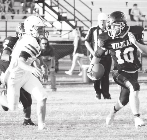 Grady running back Gunner Cherry picks up some big yardage for the Wildcats during the football season opener against Highland.