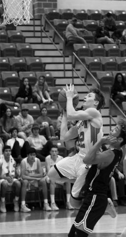 Stanton point guard Cody Beasley gets fouled while shooting a lay up Tuesday night in Stanton.