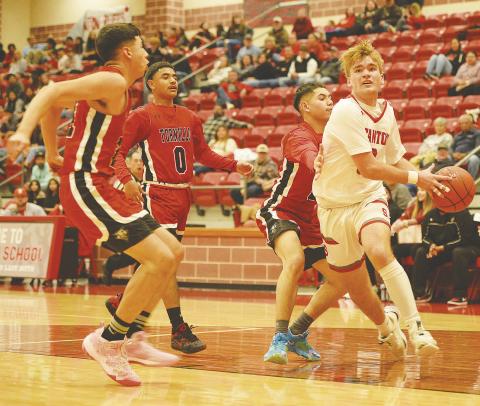 Stanton guard Nic Haas blows past a double team and scores a contested lay-up against the Tornillo Coyotes last week. Haas finished the game with eight points and the Buffaloes won the game 46-41.