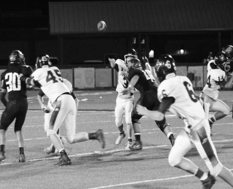 Hunter McAnally (3) zips a pass to Hunter Blaylock (6) while Cooper Wallin (45) and Kody Cates (14) secure the edges during the Wildcats game against Garden City earlier this year.
