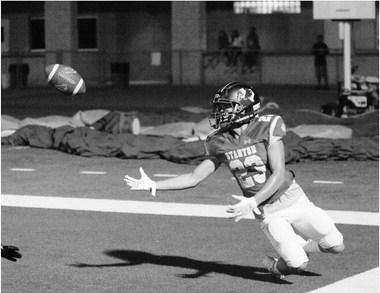 Stanton receiver Jahir Galindo makes a great sliding catch against the Merkel Badgers last week at Buffalo Stadium in Stanton.
