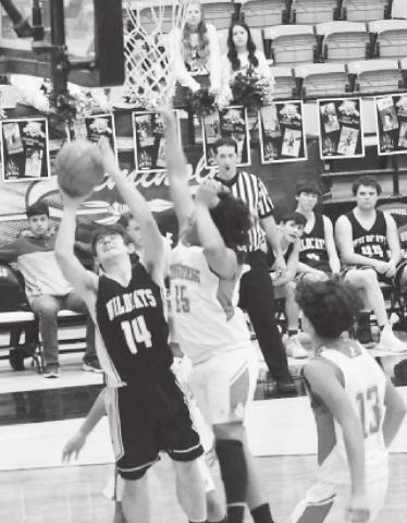 Grady Wildcat Kody Cates goes up for a tough two points during the Wildcats huge bidistrict victory over Loop on Tuesday at Seminole High School.
