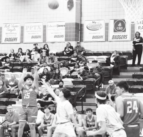 Miguel Moreno launches a three pointer late in the game against San Angelo TLCA Tuesday night at Merkel High School.