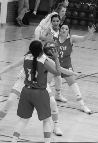 Zoey Ruiz looks to drop a pass into Hailea Vera Cruz during the Lady Buffs final district game of the season against Jim Ned.