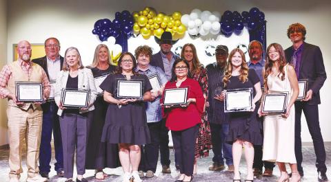 This year’s award recipients pose for a photo after being recognized at the Martin County Chamber banquet March 23.