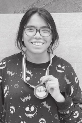 Yareli Rodriguez shows off her third place medal from Saturday’s race in Lubbock.