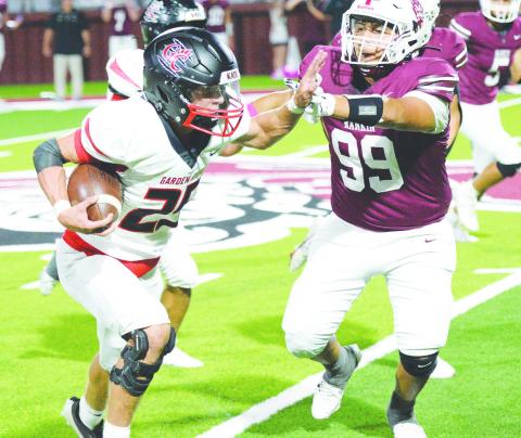Brody Walts throws a stiff arm during a kickoff return for a touchdown during the Bearkats game against Rankin on Oct. 11.