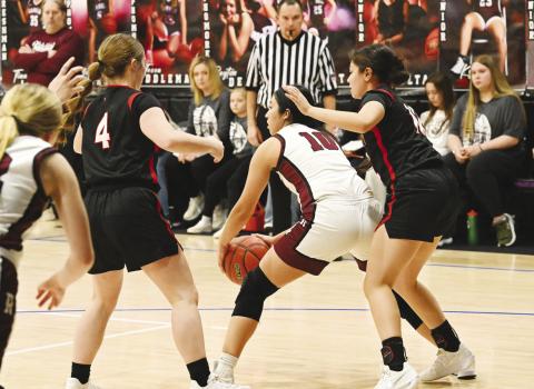 Garden City’s Ivy Braden (4) and Jasmine Nunez (12) didn’t let Rankin’s offense breathe during the Lady Kats Area Championship victory last Friday at Midland Christian.