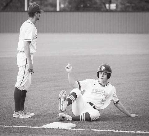 Shiner sophomore Ryan Peterson slides into third base during the regional championship victory over Sabinal last week in Jourdanton. by Howard Esse