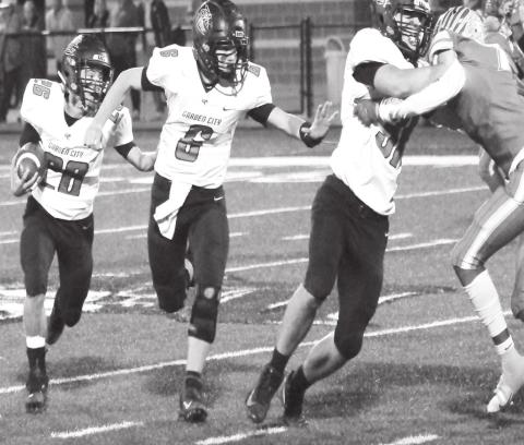 Garden City’s Jordan Jones falls in line behind lead blockers Logan Seidenberger and Mason Walker en route to one of his six rushing touchdowns against Van Horn in Thursday’s bi-district playoff game in Rankin..night in Rankin.