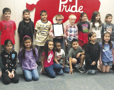 Stanton first grader Mason Belcher is pictured with his class mates after receiving an award from the Martin County Sheriff’s Office for bravery. See story this page.