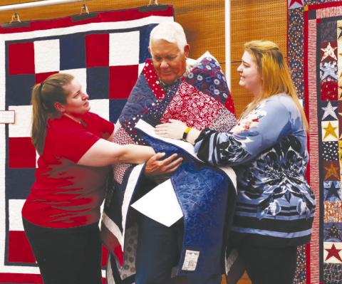 Bill Swink was wrapped in love this past weekend as he received his Quilt of Valor, a handmade quilt awarded to a service member or veteran to say, “Thank you for your service and sacrifice.”