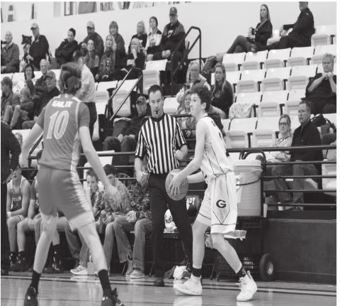 Blaise Warren looks to zip the ball cross court during the Wildcat’s district game against Borden County on Tuesday at Grady High School.