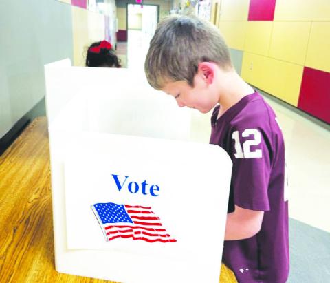Garden City first graders recently practiced their civic duty by voting for their favorite American symbol