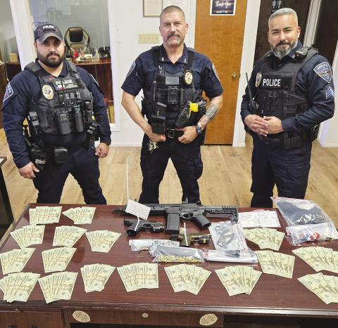 Loaded guns, THC and $1,700 in cash were seized during a traffic stop Thursday in Stanton, according to police. Authorities said the items were recovered from a vehicle after officers responded to a report of alleged threats involving firearms.