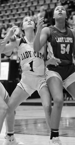 Tatum North fights for a rebound during Gardy’s bidistrict game with Whiteface Monday night in Seminole.