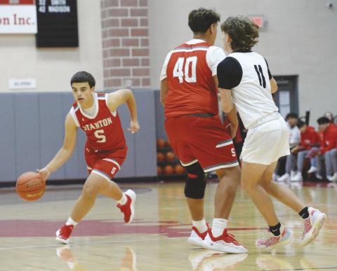 Oscar Salcido (40) sets a screen for point guard Isaiah DeLeon (5) during Hooptown action earlier this month.
