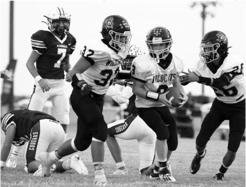 Hunter McAnally (3) recovers a fumble for Grady. He is congratulated by teammates Arath Alarcon (32) and Isaiah Ontiveros (26).
