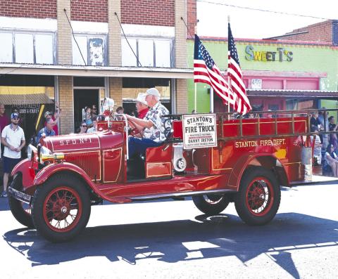 Bob Wilson and Mike Black drive Martin County’s first fire truck during Stanton’s Centennial Celebration parade on July 11. The 1928 fire truck made its Stanton debut after being restored by the Dallas Firefighters Museum in memory of longtime Stanton resident and volunteer firefighter Danny Ireton, who was killed in the line of duty in 2021. The restoration was funded through community donations, with Black providing significant support as one of the project’s major donors.