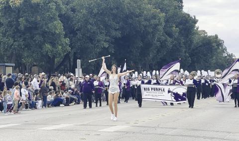 Grady High School graduate Briley Harrell leads the Abilene Christian University “Big Purple” band down the streets of Abilene on Oct. 19, during the ACU homecoming parade. Harrell is the feature twirler for the Wildcats this year. She twirls at each home game in the pre-game show, during Wildcat Walks, and during the halftime performance. She is the daughter of Trey and Sherra Harrell.