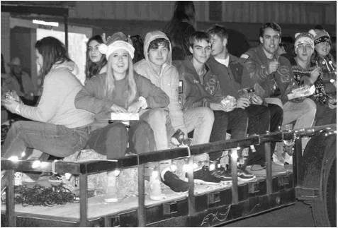 Stanton seniors toss candy canes to the crowd during the Lighted Christmas Parade.