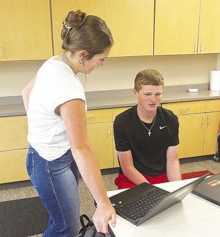 A Garden City High School reporter interviews a fellow student for the latest edition of the school’s new weekly paper, GCHS weekly.