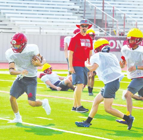 Stanton coach Cody Hogan watches his varsity offense and defense take reps during the first week of football practices. The Buffaloes are a young teams with only seven returning starters on offense and defense combined.