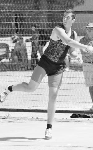 Garden City’s Jim Kinnibrugh watches his discus fly past the 100’ mark and into first place.