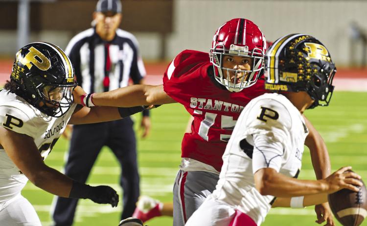 Stanton defensive lineman Marcus Glover looks to sack to Post quarterback earlier this his. Glover will look to pressure Grape Creek this Friday in Stanton as the Buffaloes try to stay at the top of the district standings.
