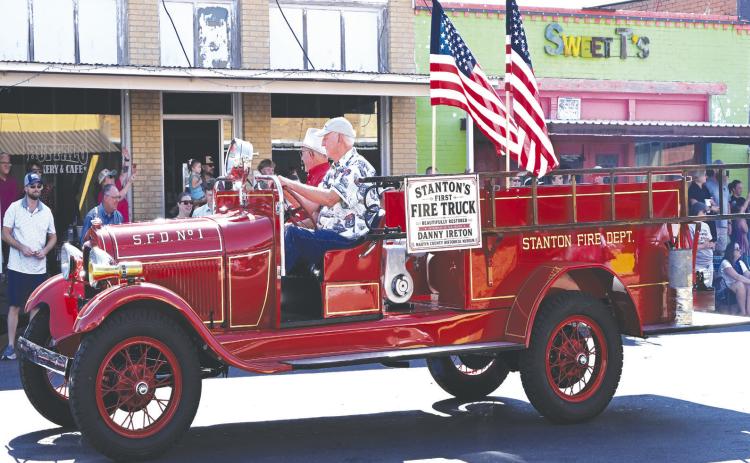 Bob Wilson and Mike Black drive Martin County’s first fire truck during Stanton’s Centennial Celebration parade on July 11. The 1928 fire truck made its Stanton debut after being restored by the Dallas Firefighters Museum in memory of longtime Stanton resident and volunteer firefighter Danny Ireton, who was killed in the line of duty in 2021. The restoration was funded through community donations, with Black providing significant support as one of the project’s major donors.