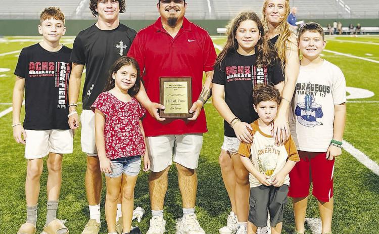 Josh Colunga stands with his wife and children after receiving his Texas Six-Man Coaches Association Hall of Fame award in Wichita Falls. Colunga, a 2011 Garden City graduate and former running back, was part of the Bearkats’ back-to-back state championship teams in 2009 and 2010.
